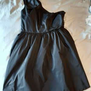 Knee length cocktail dress with bow at shoulder